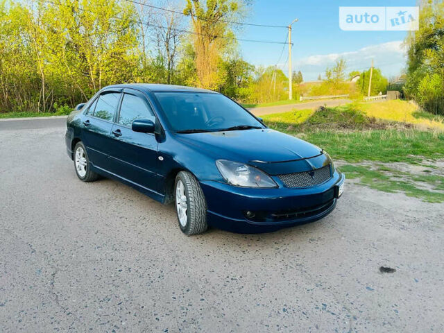 Синій Міцубісі Lancer, об'ємом двигуна 2 л та пробігом 180 тис. км за 4299 $, фото 1 на Automoto.ua