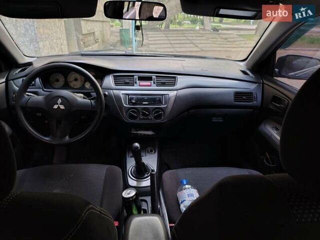 Синий Мицубиси Лансер, объемом двигателя 1.6 л и пробегом 360 тыс. км за 3000 $, фото 5 на Automoto.ua