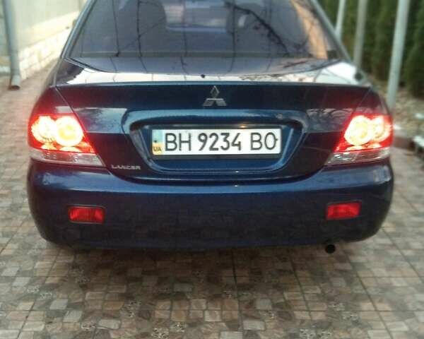 Синий Мицубиси Лансер, объемом двигателя 1.58 л и пробегом 195 тыс. км за 3990 $, фото 2 на Automoto.ua