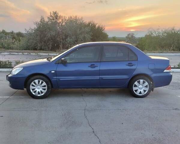 Синий Мицубиси Лансер, объемом двигателя 1.6 л и пробегом 263 тыс. км за 3400 $, фото 4 на Automoto.ua