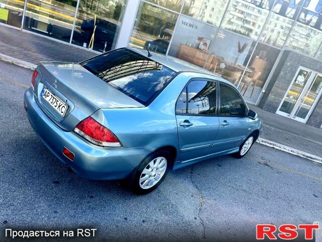 Синій Міцубісі Lancer, об'ємом двигуна 1.6 л та пробігом 273 тис. км за 3499 $, фото 3 на Automoto.ua