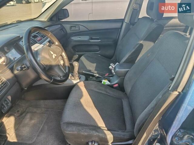 Синий Мицубиси Лансер, объемом двигателя 1.58 л и пробегом 274 тыс. км за 2650 $, фото 5 на Automoto.ua