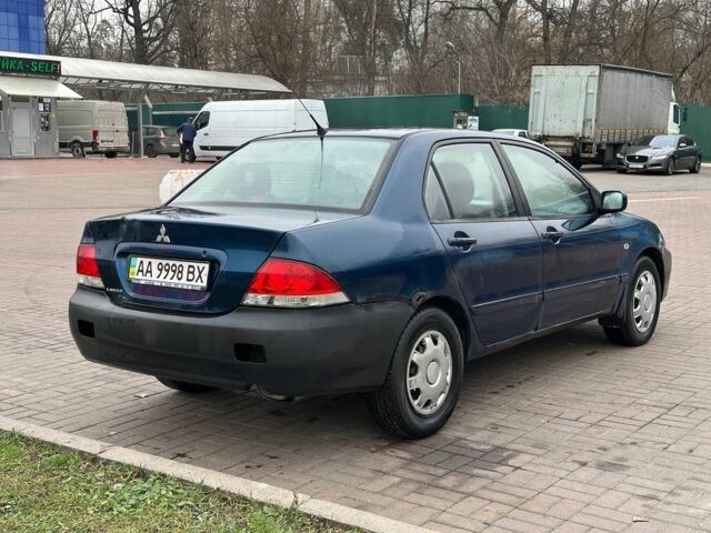 Синий Мицубиси Лансер, объемом двигателя 1.6 л и пробегом 260 тыс. км за 2300 $, фото 3 на Automoto.ua