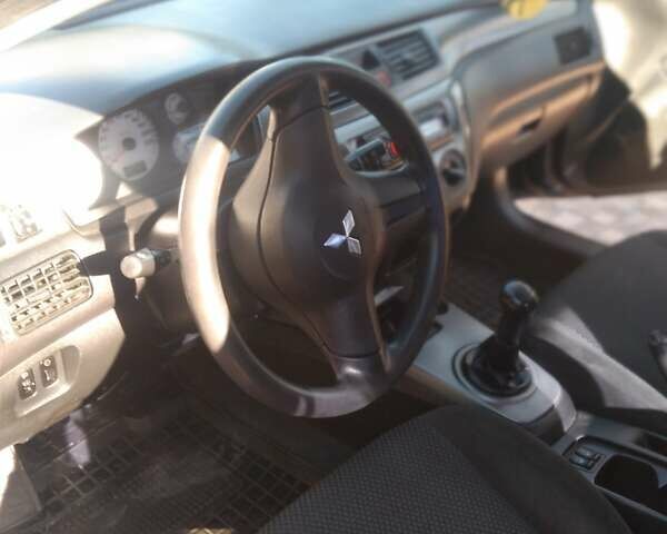 Синий Мицубиси Лансер, объемом двигателя 1.58 л и пробегом 195 тыс. км за 3990 $, фото 22 на Automoto.ua