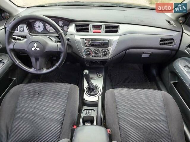 Синий Мицубиси Лансер, объемом двигателя 1.6 л и пробегом 222 тыс. км за 4599 $, фото 12 на Automoto.ua