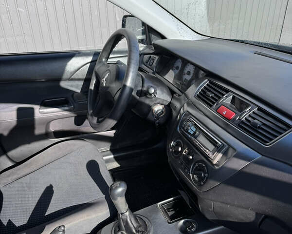 Синій Міцубісі Lancer, об'ємом двигуна 1.6 л та пробігом 148 тис. км за 3000 $, фото 20 на Automoto.ua
