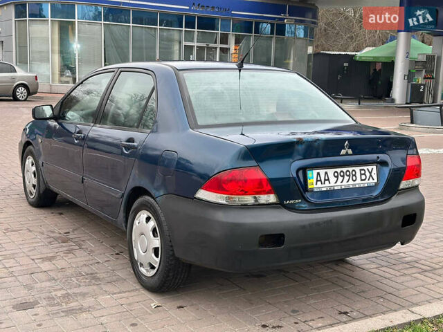 Синий Мицубиси Лансер, объемом двигателя 1.58 л и пробегом 260 тыс. км за 2300 $, фото 2 на Automoto.ua