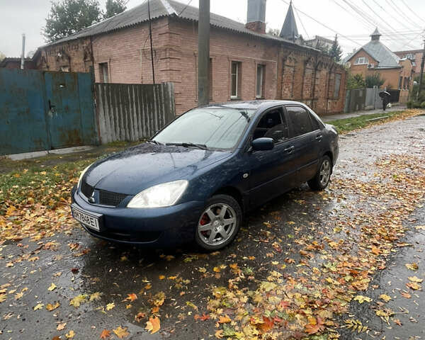 Синий Мицубиси Лансер, объемом двигателя 1.58 л и пробегом 179 тыс. км за 3800 $, фото 1 на Automoto.ua