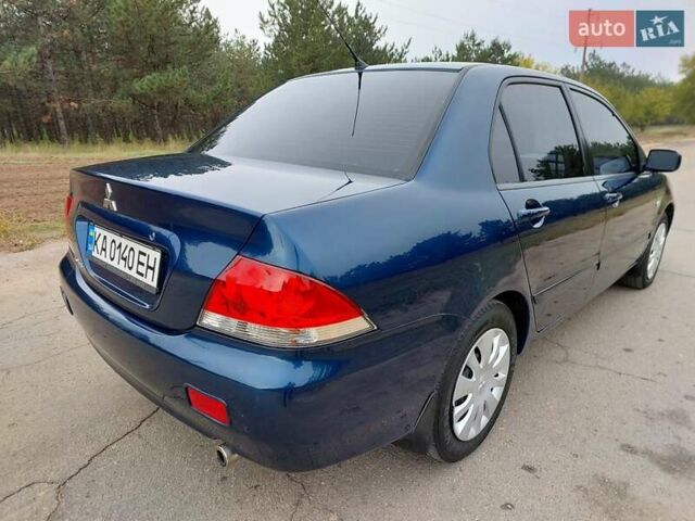 Синий Мицубиси Лансер, объемом двигателя 1.6 л и пробегом 222 тыс. км за 4599 $, фото 6 на Automoto.ua
