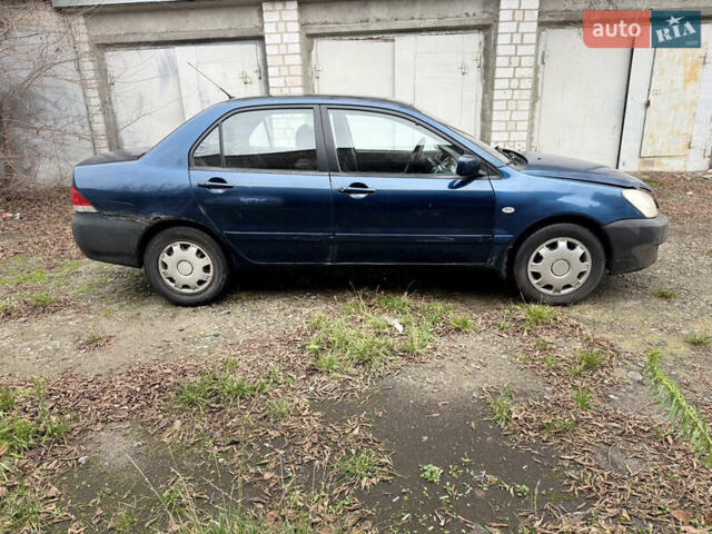 Синий Мицубиси Лансер, объемом двигателя 1.58 л и пробегом 243 тыс. км за 2900 $, фото 4 на Automoto.ua