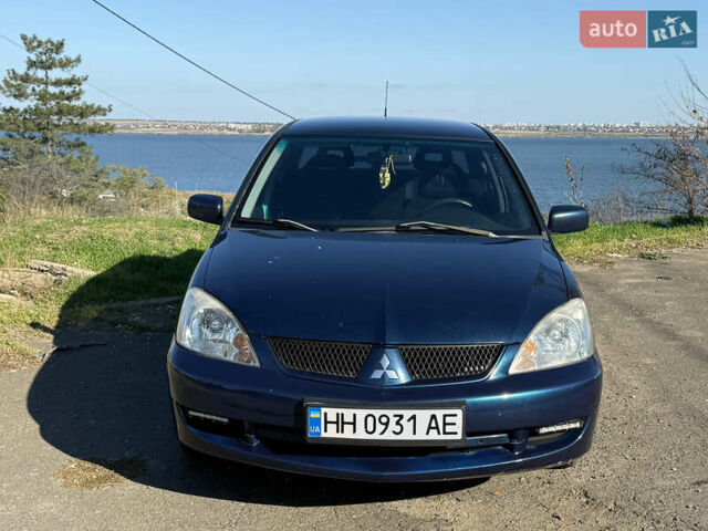 Синій Міцубісі Lancer, об'ємом двигуна 1.58 л та пробігом 269 тис. км за 3350 $, фото 1 на Automoto.ua