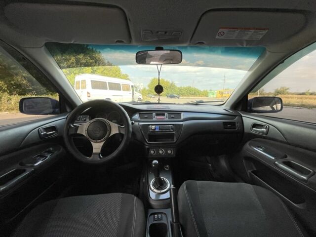 Синій Міцубісі Lancer, об'ємом двигуна 2 л та пробігом 300 тис. км за 4400 $, фото 5 на Automoto.ua