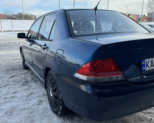 Синий Мицубиси Лансер, объемом двигателя 1.58 л и пробегом 244 тыс. км за 3300 $, фото 9 на Automoto.ua