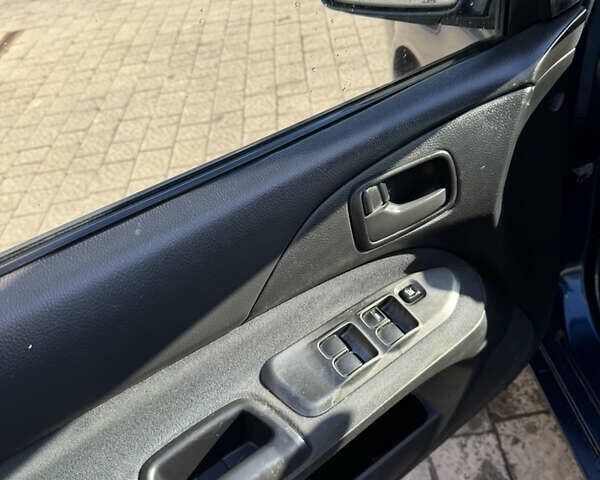 Синій Міцубісі Lancer, об'ємом двигуна 1.6 л та пробігом 148 тис. км за 3000 $, фото 7 на Automoto.ua
