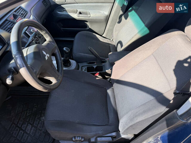 Синій Міцубісі Lancer, об'ємом двигуна 1.58 л та пробігом 269 тис. км за 3350 $, фото 8 на Automoto.ua