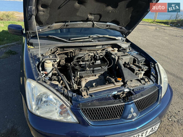 Синій Міцубісі Lancer, об'ємом двигуна 1.58 л та пробігом 269 тис. км за 3350 $, фото 24 на Automoto.ua