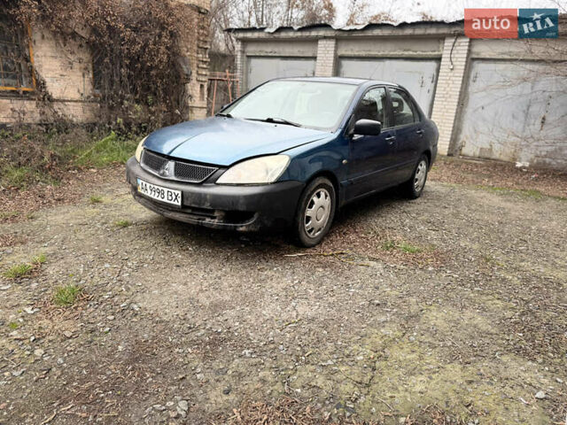 Синий Мицубиси Лансер, объемом двигателя 1.58 л и пробегом 243 тыс. км за 2900 $, фото 1 на Automoto.ua