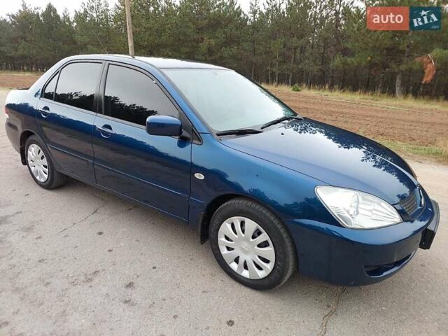 Синий Мицубиси Лансер, объемом двигателя 1.6 л и пробегом 222 тыс. км за 4599 $, фото 4 на Automoto.ua