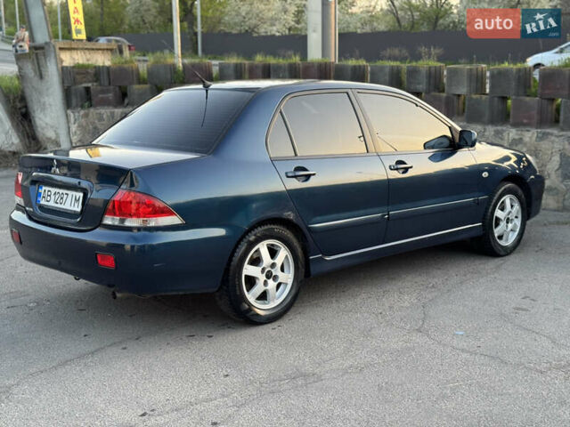 Синий Мицубиси Лансер, объемом двигателя 1.58 л и пробегом 300 тыс. км за 3650 $, фото 13 на Automoto.ua