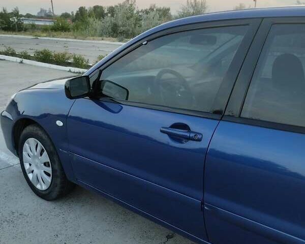 Синий Мицубиси Лансер, объемом двигателя 1.6 л и пробегом 263 тыс. км за 3400 $, фото 1 на Automoto.ua