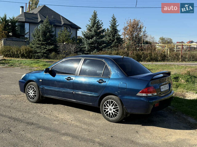 Синій Міцубісі Lancer, об'ємом двигуна 1.58 л та пробігом 269 тис. км за 3350 $, фото 5 на Automoto.ua