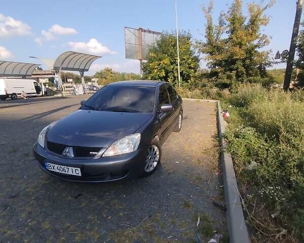 Синій Міцубісі Lancer, об'ємом двигуна 1.6 л та пробігом 290 тис. км за 4100 $, фото 5 на Automoto.ua