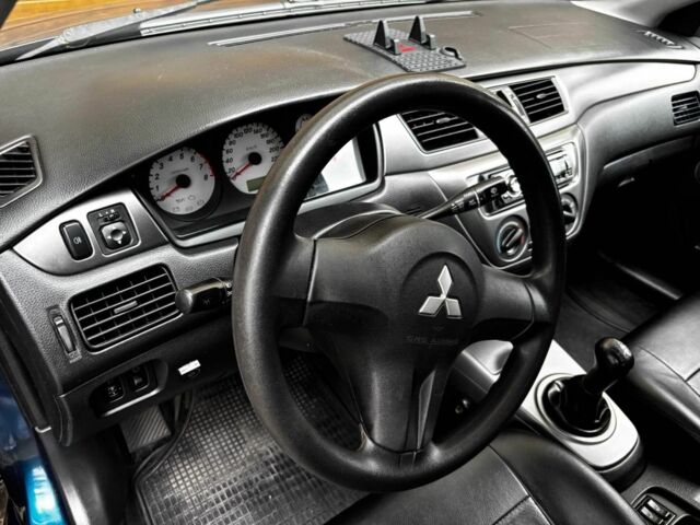 Синій Міцубісі Lancer, об'ємом двигуна 0 л та пробігом 170 тис. км за 3637 $, фото 3 на Automoto.ua
