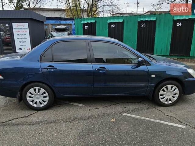 Синий Мицубиси Лансер, объемом двигателя 1.62 л и пробегом 114 тыс. км за 5200 $, фото 4 на Automoto.ua