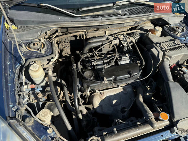 Синій Міцубісі Lancer, об'ємом двигуна 1.58 л та пробігом 269 тис. км за 3350 $, фото 25 на Automoto.ua