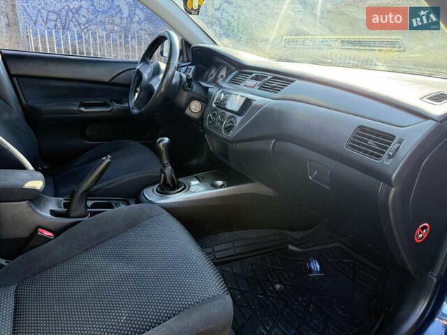 Синій Міцубісі Lancer, об'ємом двигуна 1.58 л та пробігом 269 тис. км за 3350 $, фото 22 на Automoto.ua