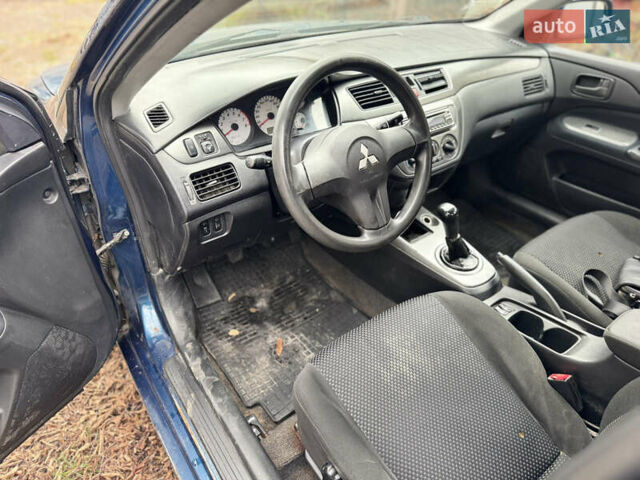 Синий Мицубиси Лансер, объемом двигателя 1.58 л и пробегом 243 тыс. км за 2900 $, фото 9 на Automoto.ua