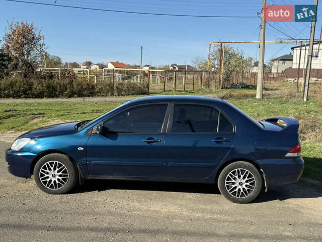 Синій Міцубісі Lancer, об'ємом двигуна 1.58 л та пробігом 269 тис. км за 3350 $, фото 4 на Automoto.ua