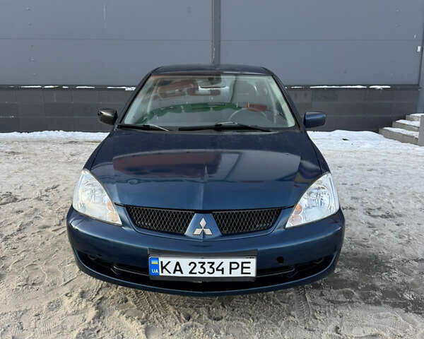 Синий Мицубиси Лансер, объемом двигателя 1.58 л и пробегом 244 тыс. км за 3300 $, фото 1 на Automoto.ua