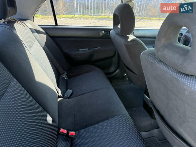 Синій Міцубісі Lancer, об'ємом двигуна 1.58 л та пробігом 269 тис. км за 3350 $, фото 20 на Automoto.ua