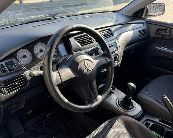 Синій Міцубісі Lancer, об'ємом двигуна 1.6 л та пробігом 148 тис. км за 3000 $, фото 8 на Automoto.ua
