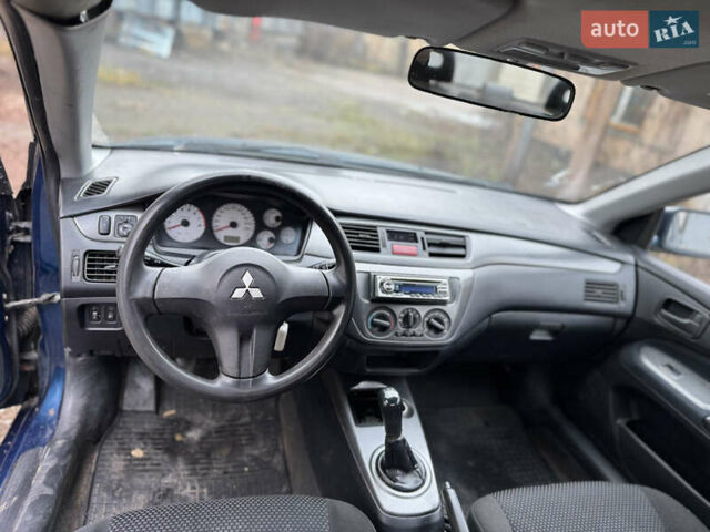 Синий Мицубиси Лансер, объемом двигателя 1.58 л и пробегом 243 тыс. км за 2900 $, фото 11 на Automoto.ua