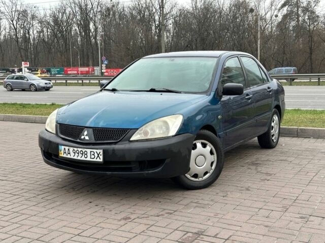 Синий Мицубиси Лансер, объемом двигателя 1.6 л и пробегом 260 тыс. км за 2300 $, фото 1 на Automoto.ua