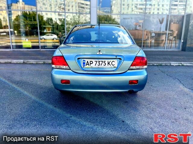 Синій Міцубісі Lancer, об'ємом двигуна 1.6 л та пробігом 273 тис. км за 3499 $, фото 2 на Automoto.ua