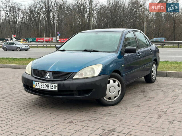Синий Мицубиси Лансер, объемом двигателя 1.58 л и пробегом 260 тыс. км за 2300 $, фото 1 на Automoto.ua