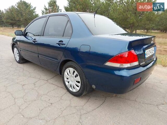 Синий Мицубиси Лансер, объемом двигателя 1.6 л и пробегом 222 тыс. км за 4599 $, фото 5 на Automoto.ua