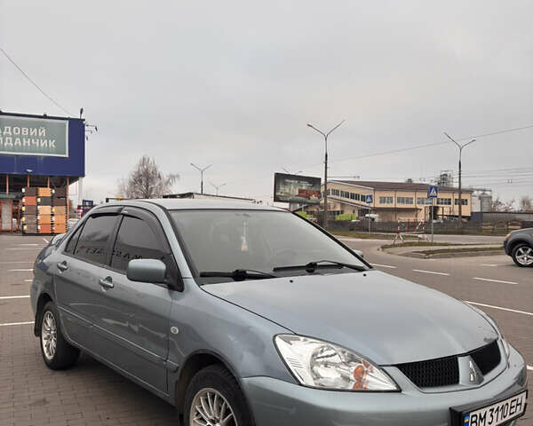 Синий Мицубиси Лансер, объемом двигателя 1.6 л и пробегом 238 тыс. км за 3500 $, фото 2 на Automoto.ua