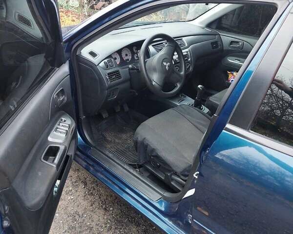 Синий Мицубиси Лансер, объемом двигателя 1.6 л и пробегом 87 тыс. км за 6800 $, фото 3 на Automoto.ua