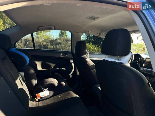 Синій Міцубісі Lancer, об'ємом двигуна 2 л та пробігом 240 тис. км за 6800 $, фото 10 на Automoto.ua
