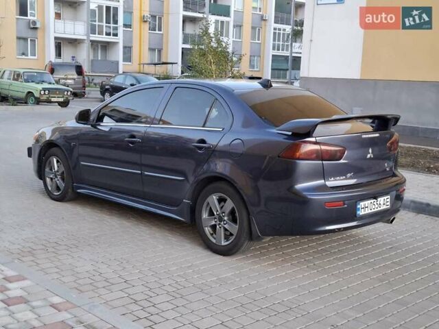 Синій Міцубісі Lancer, об'ємом двигуна 2 л та пробігом 234 тис. км за 6700 $, фото 3 на Automoto.ua