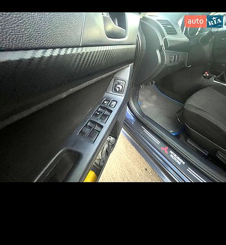 Синій Міцубісі Lancer, об'ємом двигуна 2 л та пробігом 273 тис. км за 6000 $, фото 10 на Automoto.ua