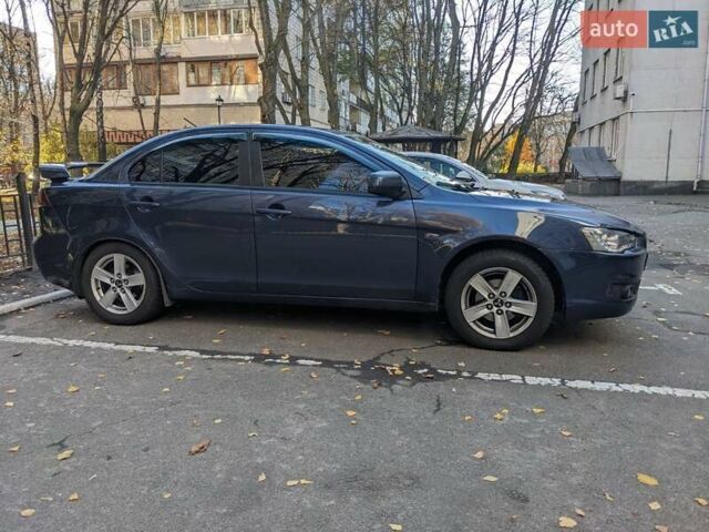 Синий Мицубиси Лансер, объемом двигателя 2 л и пробегом 300 тыс. км за 6250 $, фото 2 на Automoto.ua