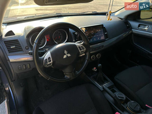 Синій Міцубісі Lancer, об'ємом двигуна 2 л та пробігом 240 тис. км за 6800 $, фото 6 на Automoto.ua