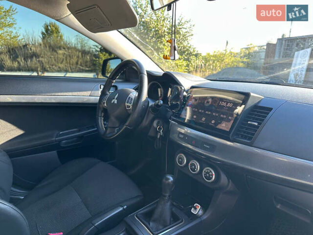 Синій Міцубісі Lancer, об'ємом двигуна 2 л та пробігом 240 тис. км за 6800 $, фото 4 на Automoto.ua