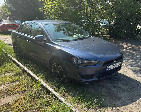 Синий Мицубиси Лансер, объемом двигателя 1.47 л и пробегом 250 тыс. км за 4500 $, фото 3 на Automoto.ua