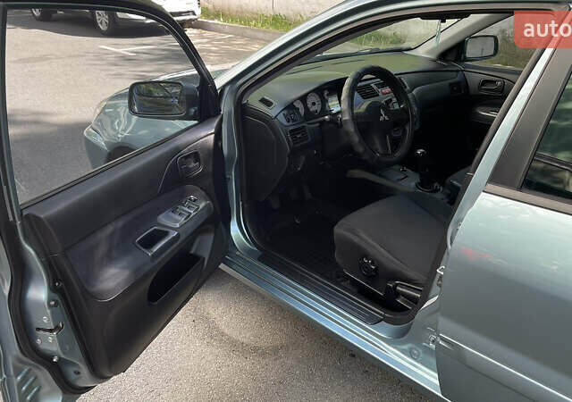 Синій Міцубісі Lancer, об'ємом двигуна 1.58 л та пробігом 210 тис. км за 5300 $, фото 6 на Automoto.ua